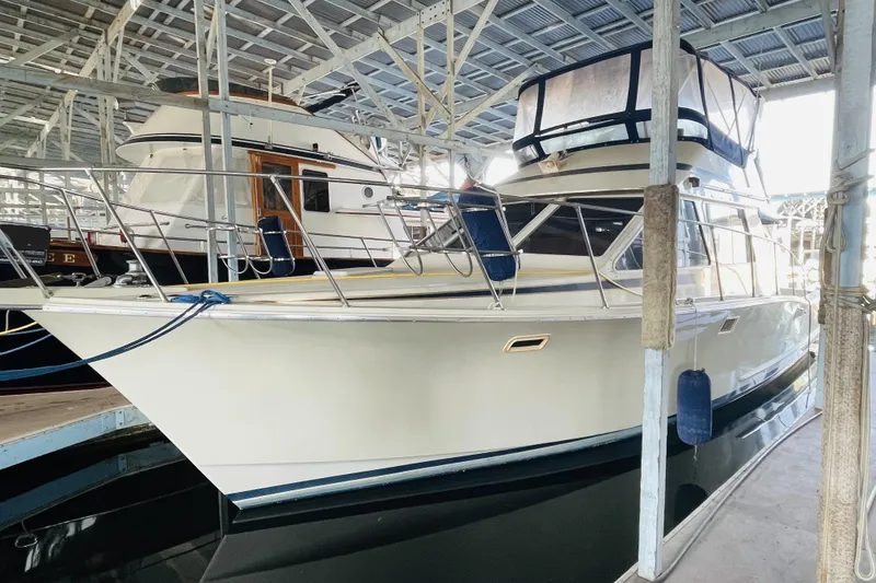 Slide: The Image of 1987 Tollycraft 40 Sport Sedan yacht docked in a covered marina. - 8