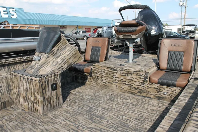 Slide: The Image of 2026 Excel Bolt 203 boat interior with camo design and leather seats. - 4