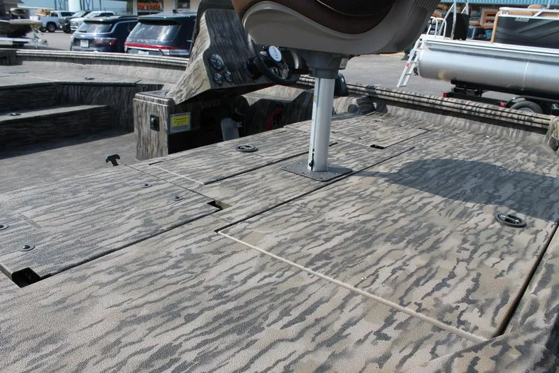 Slide: The Image of 2026 Excel Bolt 203 boat deck with camouflage pattern and seating. - 8