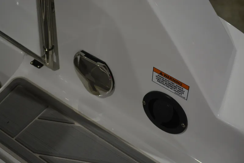 Slide: The Image of 2026 Monterey M-45 boat detail with warning label and sleek design elements. - 16