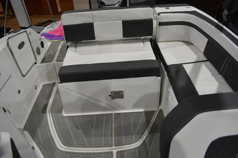 Slide: The Image of 2026 Monterey M-45 boat interior with sleek black and white seating arrangement. - 28