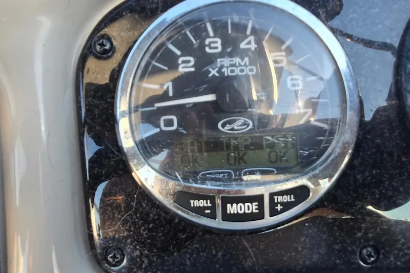 Slide: The Image of Close-up of 2006 Sea Ray 260 Sundancer tachometer displaying RPM and status indicators. - 11