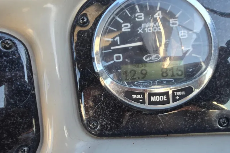 Slide: The Image of Close-up of 2006 Sea Ray 260 Sundancer dashboard gauge showing RPM and voltage. - 12