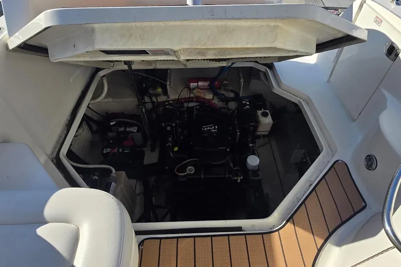 Slide: The Image of Engine compartment of a 2006 Sea Ray 260 Sundancer boat, open for maintenance. - 5