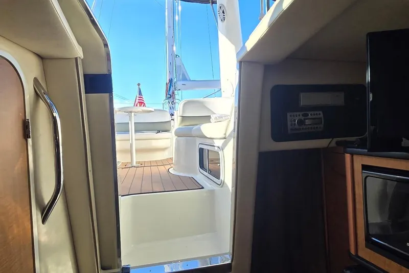 Slide: The Image of Interior view of 2006 Sea Ray 260 Sundancer yacht, showing cabin and deck seating. - 7