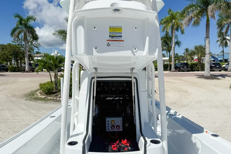 Slide: The Image of Steering console of 2026 Yellowfin 24 Bay CE boat, featuring modern controls and sleek design. - 7