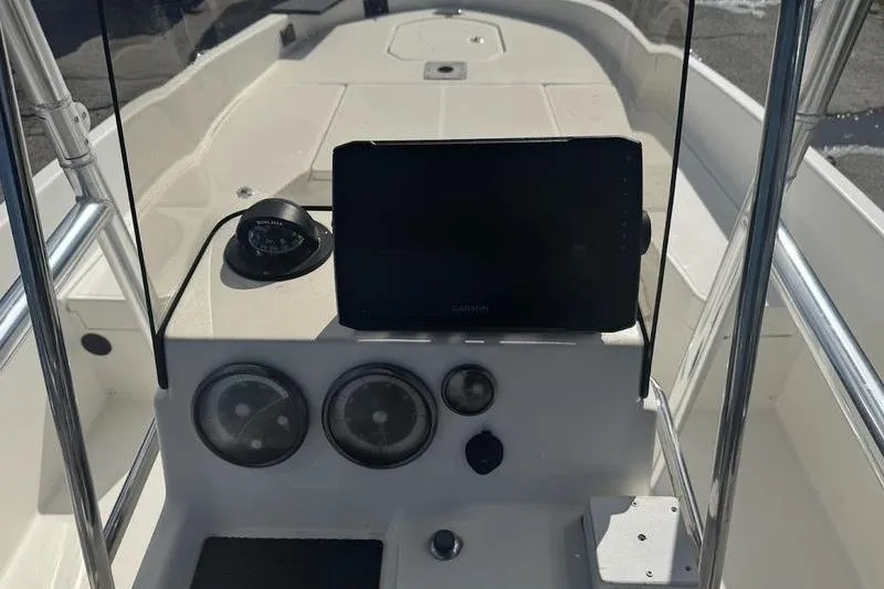 Slide: The Image of 2018 Bayliner Element F21 boat dashboard with gauges and navigation equipment. - 12