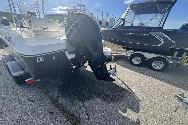 Slide: The Image of 2018 Bayliner Element F21 boat with Mercury outboard motor on a trailer. - 3