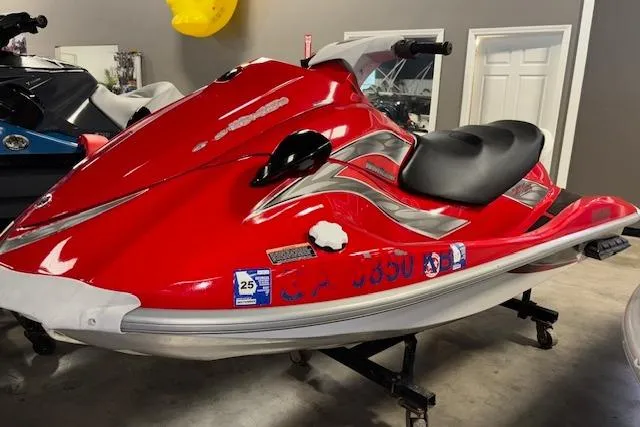 Slide: The Image of 2005 Yamaha WaveRunner VX 110 in red, displayed indoors on a stand. - 3