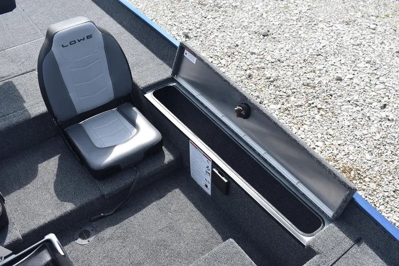 Slide: The Image of Carpeted storage compartment in 2026 Lowe Skorpion 17 boat interior. - 11