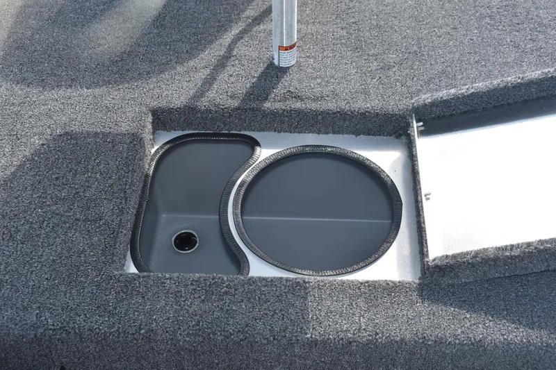 Slide: The Image of Open storage compartment on 2026 Lowe Skorpion 17 boat, featuring a sleek design. - 13