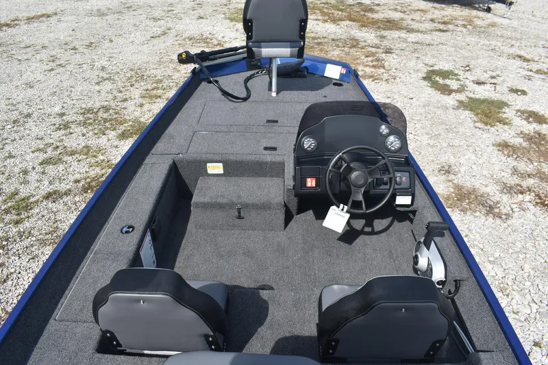 Slide: The Image of 2026 Lowe Skorpion 17 boat cockpit with steering wheel and control panel. - 8