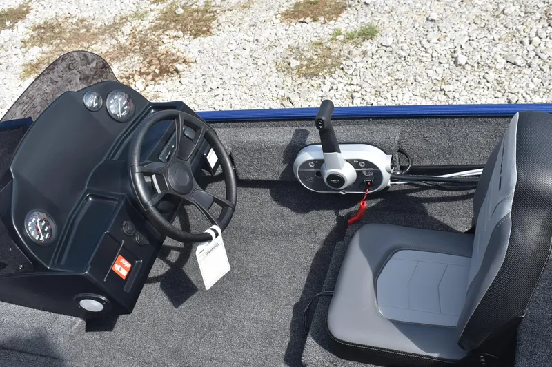 Slide: The Image of Interior view of 2026 Lowe Skorpion 17 boat with gray carpeted flooring. - 9