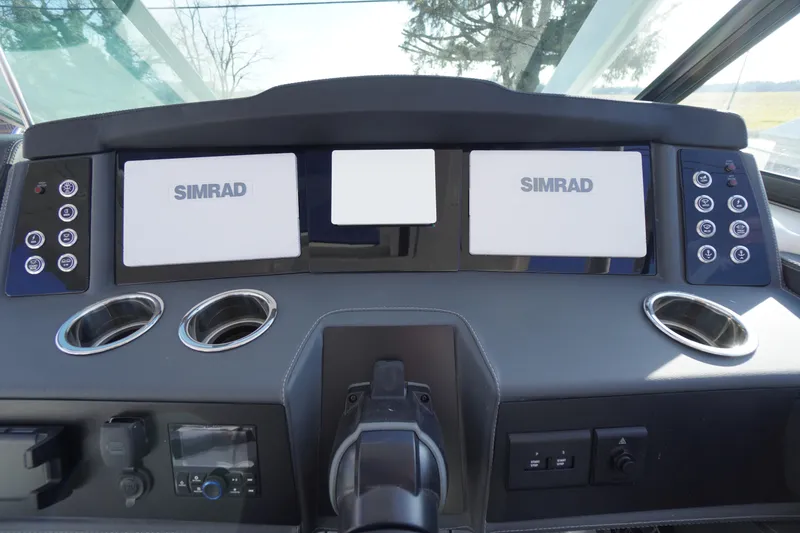 Slide: The Image of Dashboard of 2026 Chaparral 280 OSX boat with Simrad displays and controls. - 15