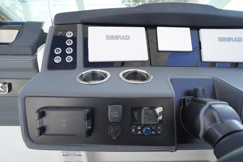 Slide: The Image of Dashboard of 2026 Chaparral 280 OSX boat with Simrad displays and controls. - 18
