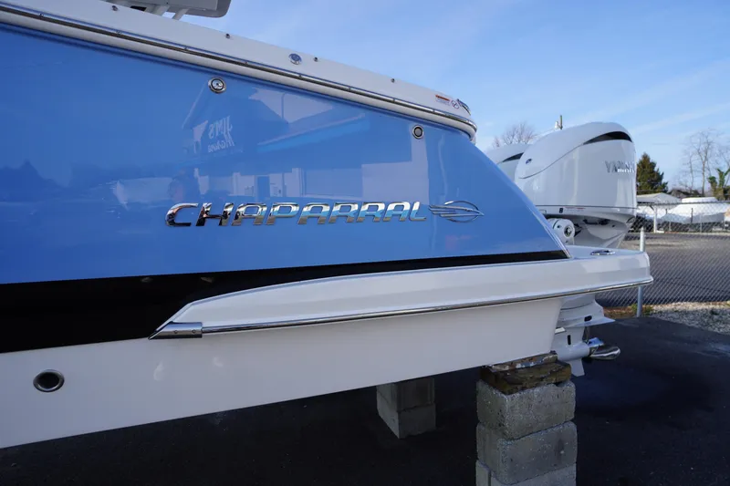 Slide: The Image of 2026 Chaparral 280 OSX boat with Yamaha engine, displayed outdoors. - 3