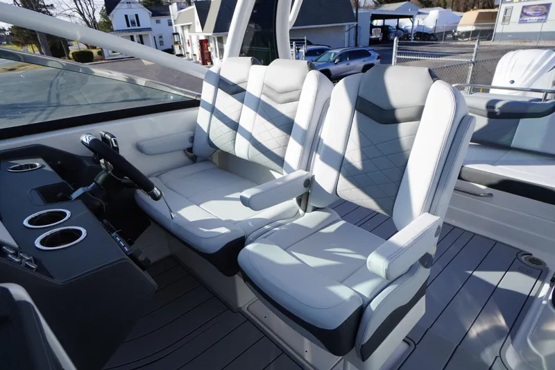 Slide: The Image of 2026 Chaparral 280 OSX boat interior with modern seating and steering console. - 30