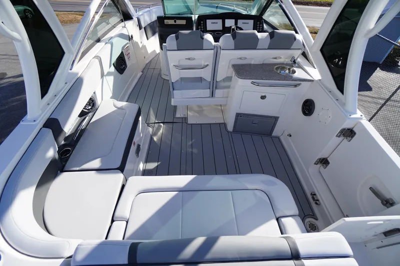 Slide: The Image of Luxurious interior of 2026 Chaparral 280 OSX boat with seating and kitchenette. - 38