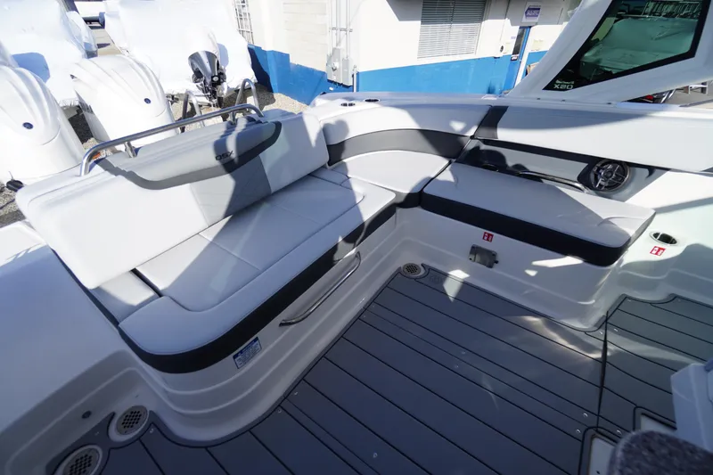 Slide: The Image of 2026 Chaparral 280 OSX boat interior with sleek seating and modern design. - 45