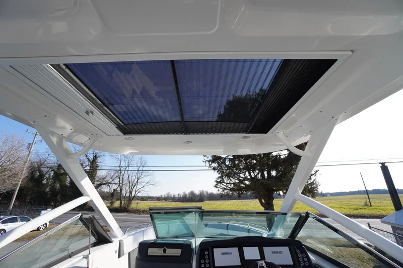 Slide: The Image of 2026 Chaparral 280 OSX boat with sleek cockpit and modern roof design. - 51