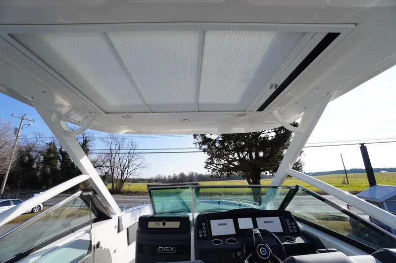 Slide: The Image of 2026 Chaparral 280 OSX boat cockpit with modern controls and sunroof. - 52
