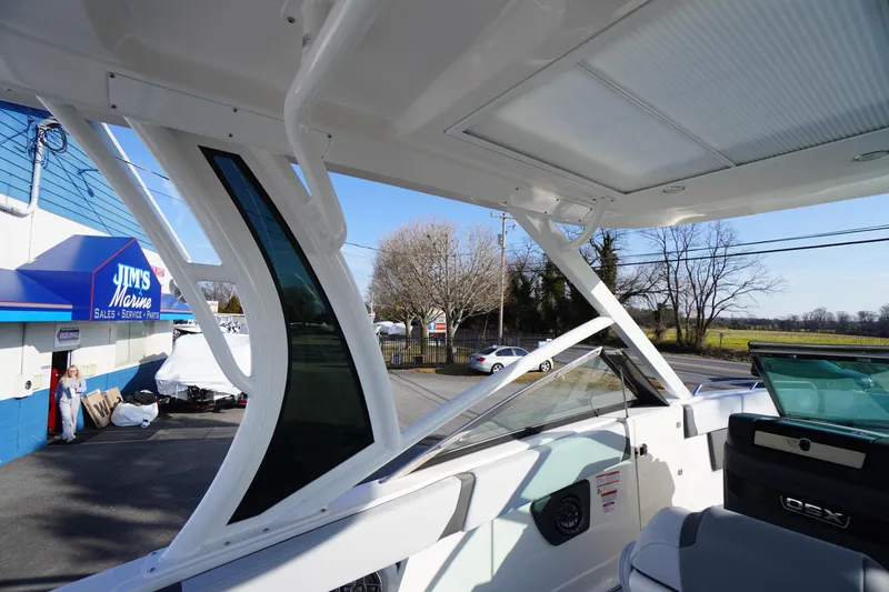 Slide: The Image of 2026 Chaparral 280 OSX boat at Jim's Marine dealership, showcasing sleek design and modern features. - 53