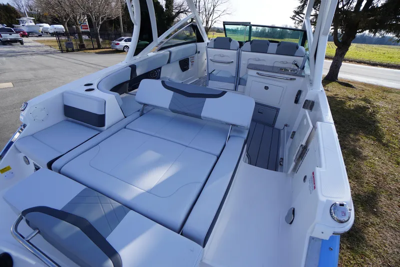 Slide: The Image of 2026 Chaparral 280 OSX boat interior with luxurious seating and modern design. - 56