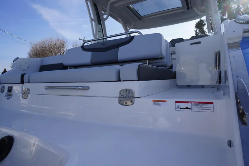 Slide: The Image of 2026 Chaparral 280 OSX boat interior with sleek seating and modern design. - 58