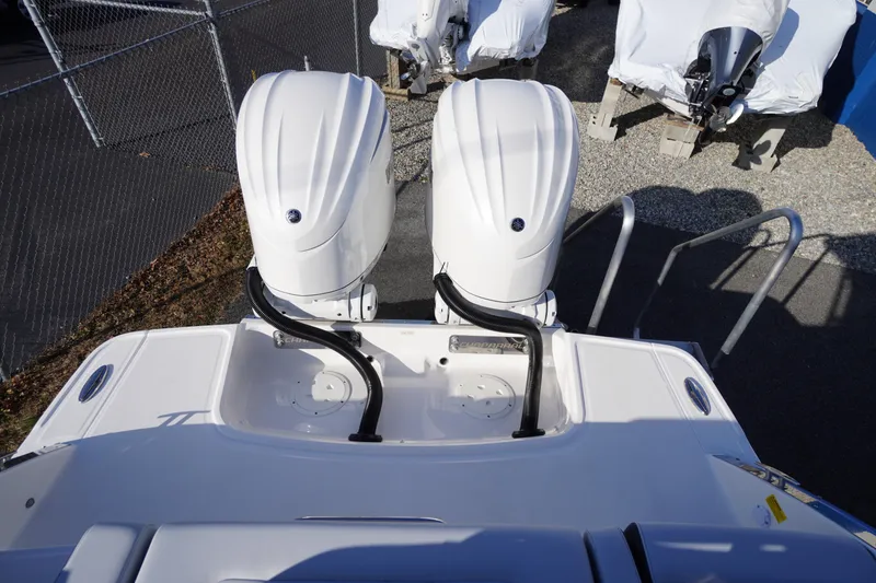 Slide: The Image of 2026 Chaparral 280 OSX boat with dual outboard engines, viewed from above. - 65