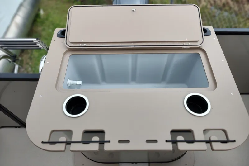 Slide: The Image of 2026 Sylvan Mirage 820 PARTY FISH boat console with cup holders and storage compartment. - 17