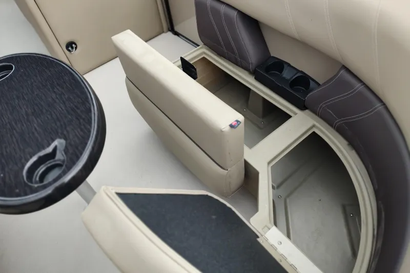 Slide: The Image of 2026 Sylvan Mirage 820 PARTY FISH boat interior with storage and cup holders. - 19