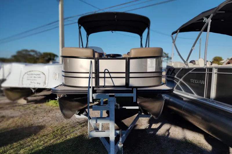 Slide: The Image of 2026 Sylvan Mirage 820 PARTY FISH pontoon boat on trailer, outdoor display. - 7