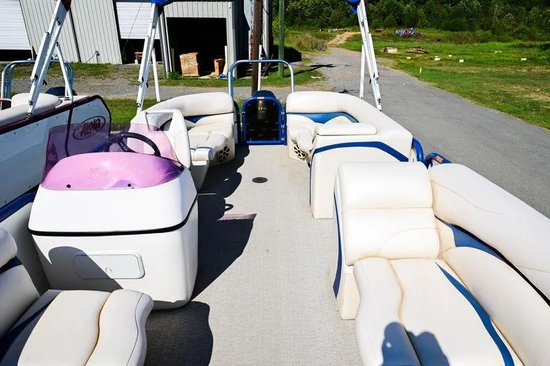 Slide: The Image of 2023 Aloha Pontoon boat with spacious seating and modern design. - 11