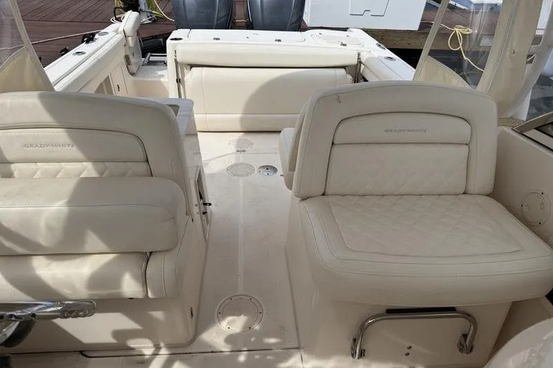 Slide: The Image of 2019 Grady-White Freedom 285 boat interior with cream leather seating. - 12
