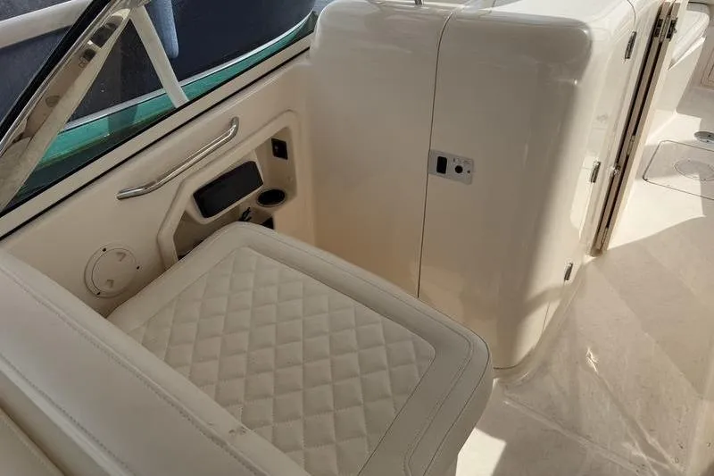 Slide: The Image of 2019 Grady-White Freedom 285 boat interior with quilted seating and storage compartments. - 5