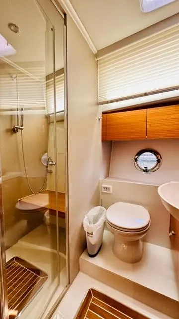 Slide: The Image of Luxurious bathroom in 2022 Greenline 48 Flybridge yacht, featuring modern shower and elegant wood accents. - 17