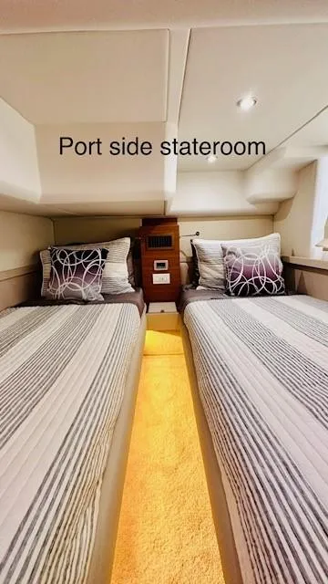Slide: The Image of Port side stateroom in 2022 Greenline 48 Flybridge yacht with twin beds. - 20