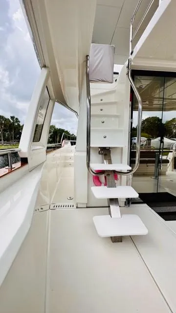Slide: The Image of 2022 Greenline 48 Flybridge yacht with hardtop, featuring sleek exterior and modern design elements. - 30