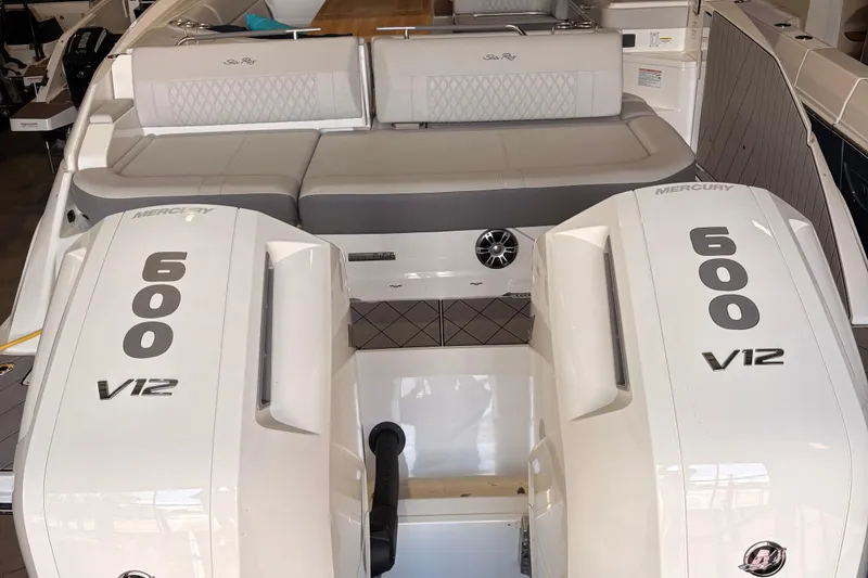 Slide: The Image of 2025 Searay 400 SLX boat with dual Mercury 600 V12 engines, luxury seating. - 19