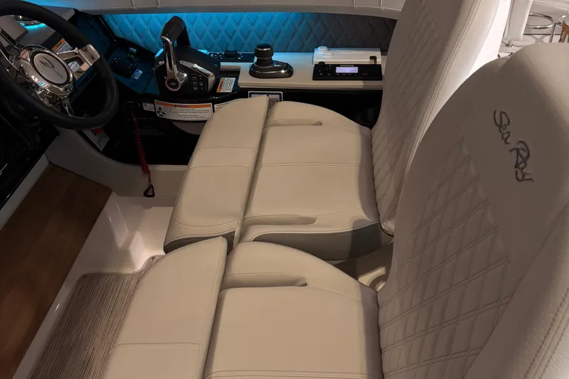 Slide: The Image of Luxurious interior of 2025 Searay 400 SLX boat with ambient lighting and seating. - 8