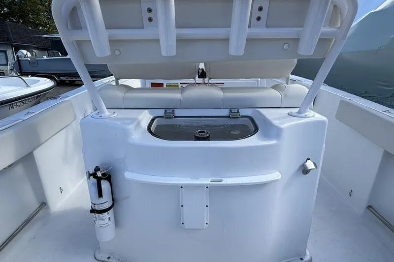 Slide: The Image of 2024 Sea Hunt Ultra 229 boat interior with seating and storage compartment. - 3