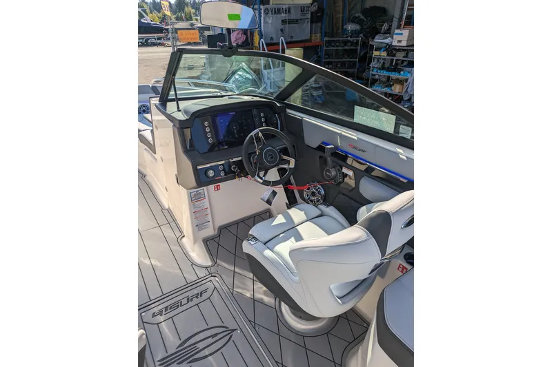 Slide: The Image of Interior of 2026 Chaparral 6 GTS boat with modern dashboard and seating. - 10