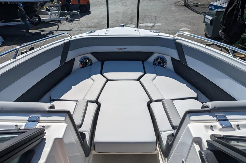 Slide: The Image of 2026 Chaparral 6 GTS boat interior with cushioned seating and built-in speakers. - 13