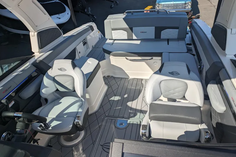 Slide: The Image of 2026 Chaparral 6 GTS boat interior with luxurious seating and modern design. - 16