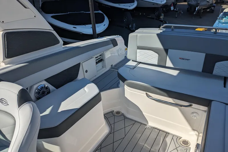 Slide: The Image of 2026 Chaparral 6 GTS boat interior with sleek seating and modern design. - 17