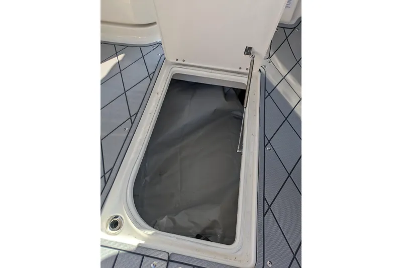 Slide: The Image of Open storage compartment on 2026 Chaparral 6 GTS boat deck. - 20