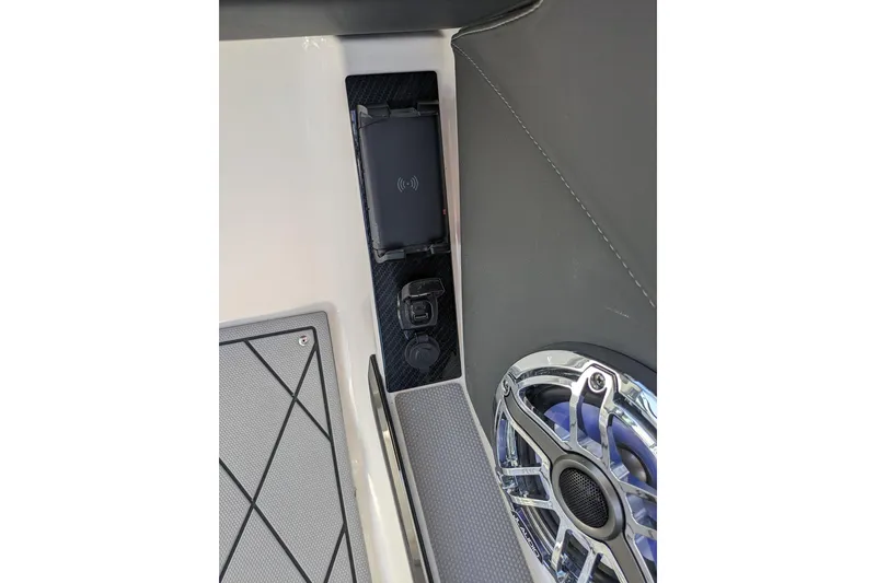 Slide: The Image of Interior of 2026 Chaparral 6 GTS featuring speaker and charging port. - 21