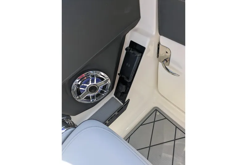 Slide: The Image of Interior of 2026 Chaparral 6 GTS boat with speaker and handle detail. - 22