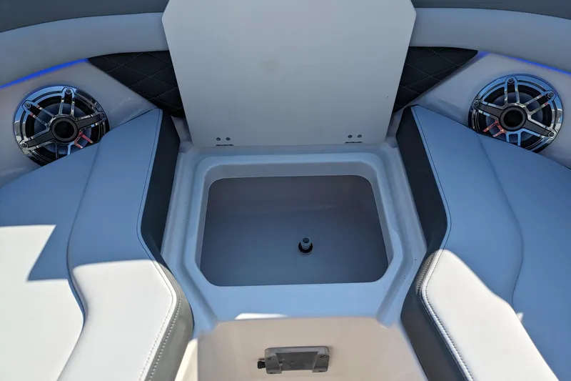 Slide: The Image of Interior of 2026 Chaparral 6 GTS boat with speakers and storage compartment. - 24