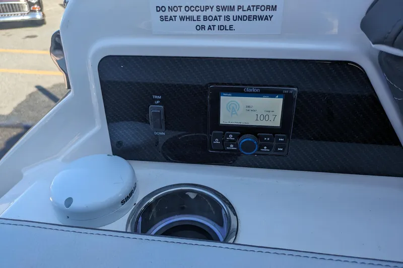 Slide: The Image of 2026 Chaparral 6 GTS boat dashboard with Clarion radio and Simrad device. - 29